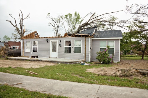 Residence a week after being struck by a tornado.  Some clean up has been completed.