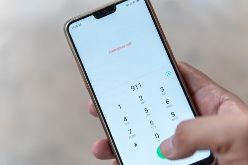 Emergency and urgency, dialing 911 on smartphone screen. Shallow depth of field.