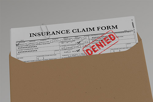An envelope containing an insurance claim form, part of a guide for appealing winter storm damage claims.
