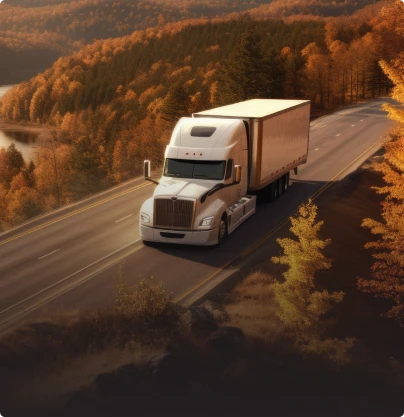 A semi truck travels along a road surrounded by autumn trees, some of which display damage from a recent hailstorm.