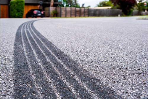 Tyre track on asphalt from hard braking - shallow focus